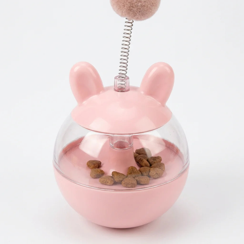 Tumbler dispenser close-up showing treat compartment